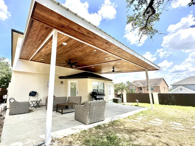 Modern cantilevered patio cover with cedar ceiling